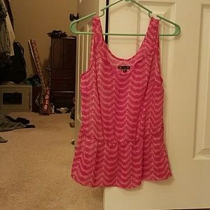 Pink peplum sleeveless blouse